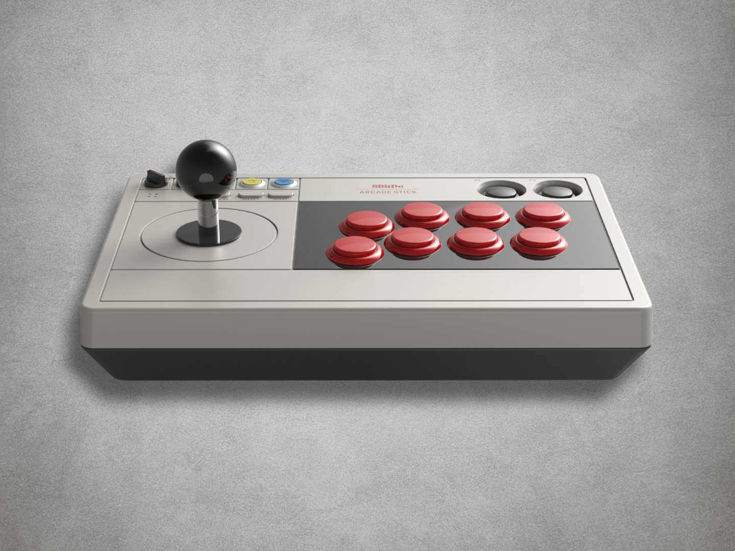 8BitDo Arcade stick with red buttons and joystick on a grey background play view