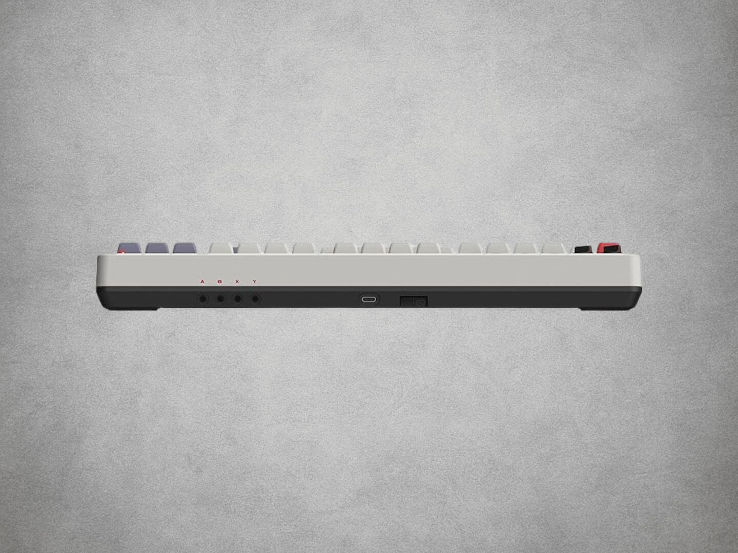 8BitDo Mechanical Keyboard NES with red and grey keys on a grey background Top View