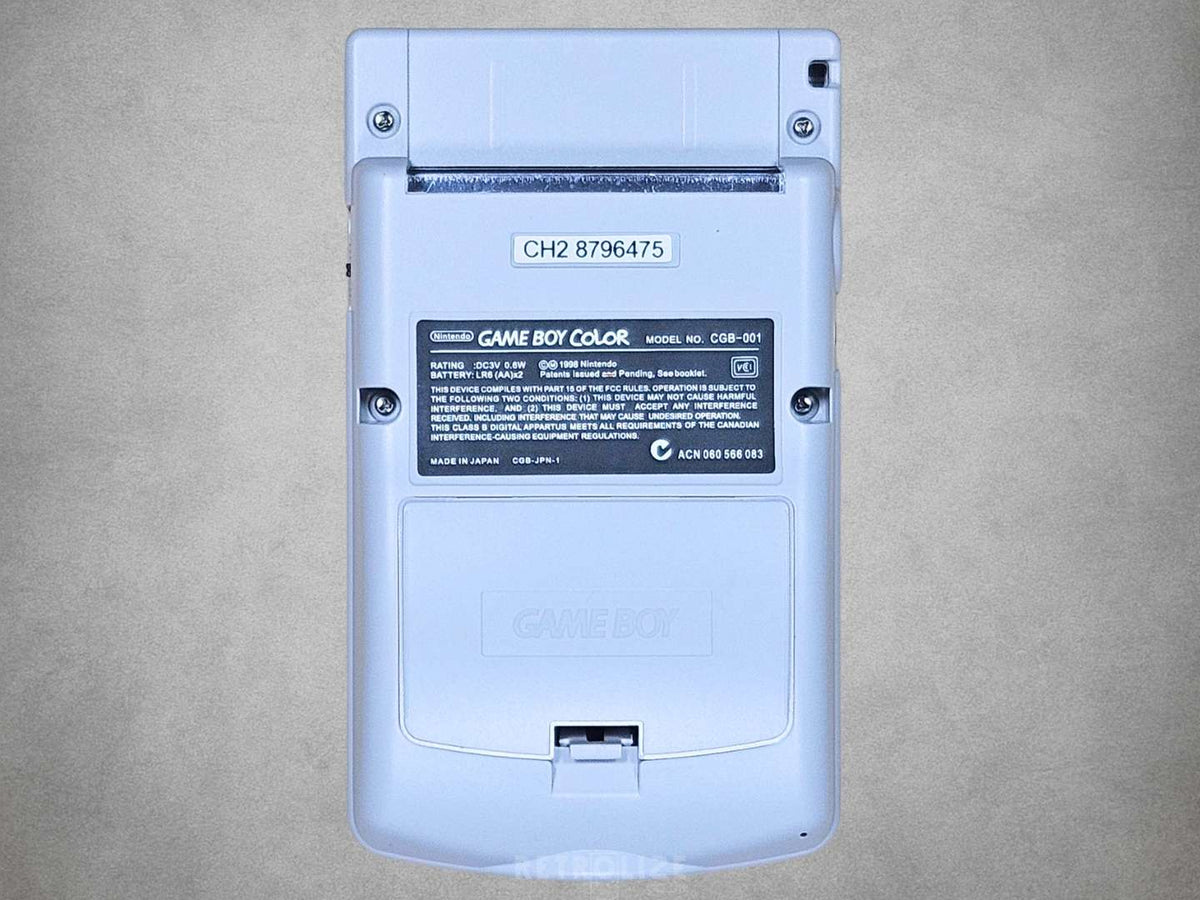 Rear view of the Nintendo Game Boy Color DMG Edition showing the grey housing, battery cover and cartridge slot