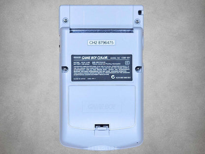 Rear view of the Nintendo Game Boy Color DMG Edition showing the grey housing, battery cover and cartridge slot