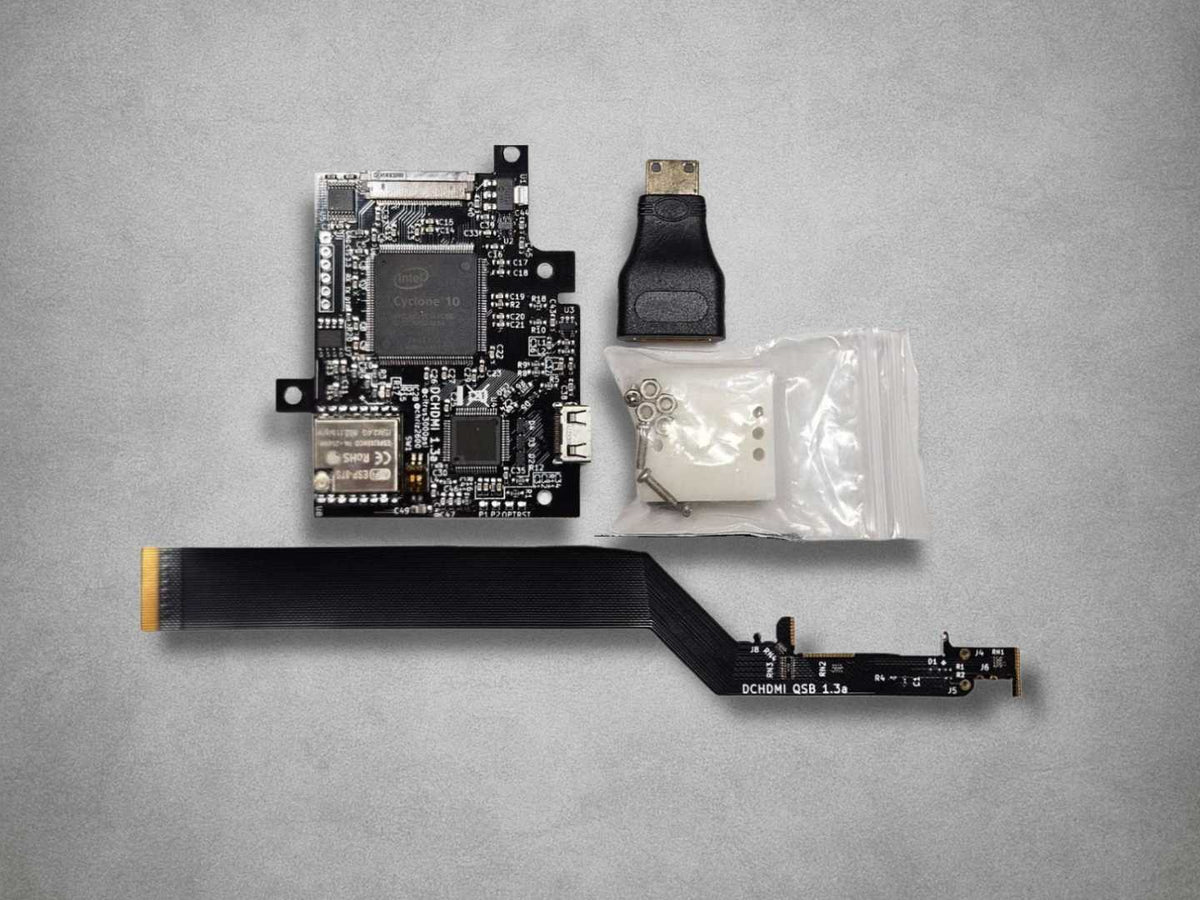 DCHDMI HW1 Sega Dreamcast HDMI mod kit showing board, flex cable, drill template, fixings and HDMI adapter