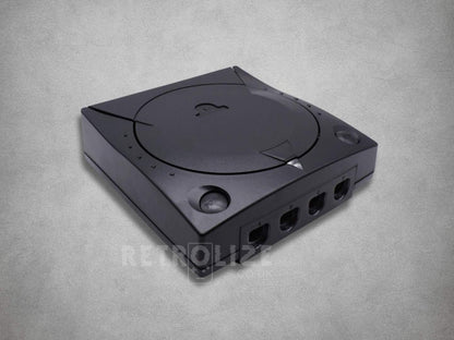 Black Sega Dreamcast ABS replacement shell showing the disc lid, matching buttons and controller port openings