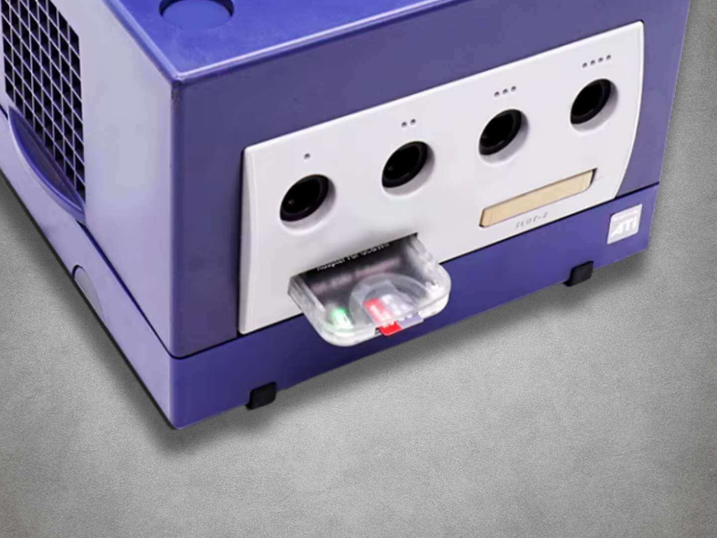 GC2SD Adapter SDGEKO on grey background in use in gamecube