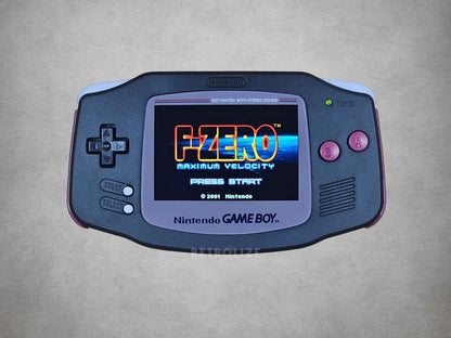 Nintendo Game Boy Advance displaying the title screen of 'F-Zero' on a grey background
