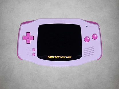 Pink Game Boy Advance with Hot Pink buttons on a grey background screen off
