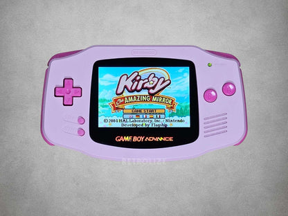 Pink Game Boy Advance with Hot Pink buttons Kirby on screen on a grey background