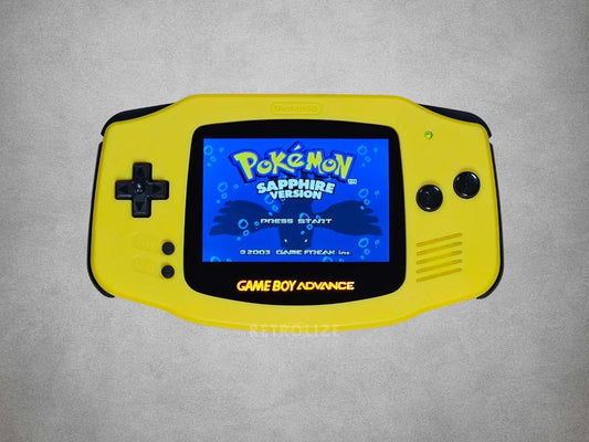 Yellow Game Boy Advance displaying 'Pokémon Sapphire Version' on a grey background