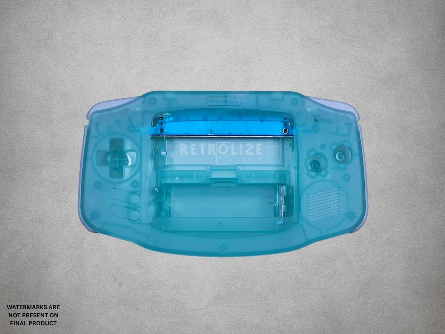 Clear Aqua Blue Game Boy Advance shell on grey background