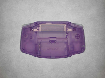 Atomic Purple Game Boy Advance shell back on grey background