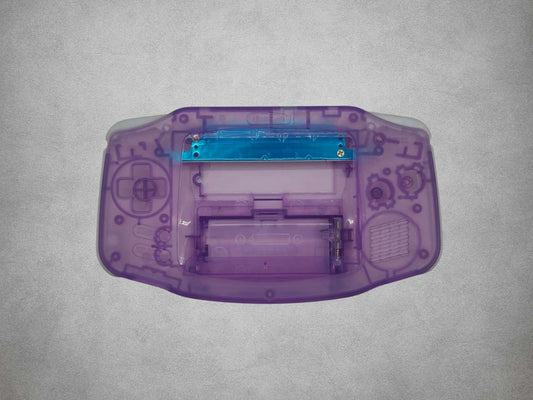 Atomic Purple Game Boy Advance shell on grey background