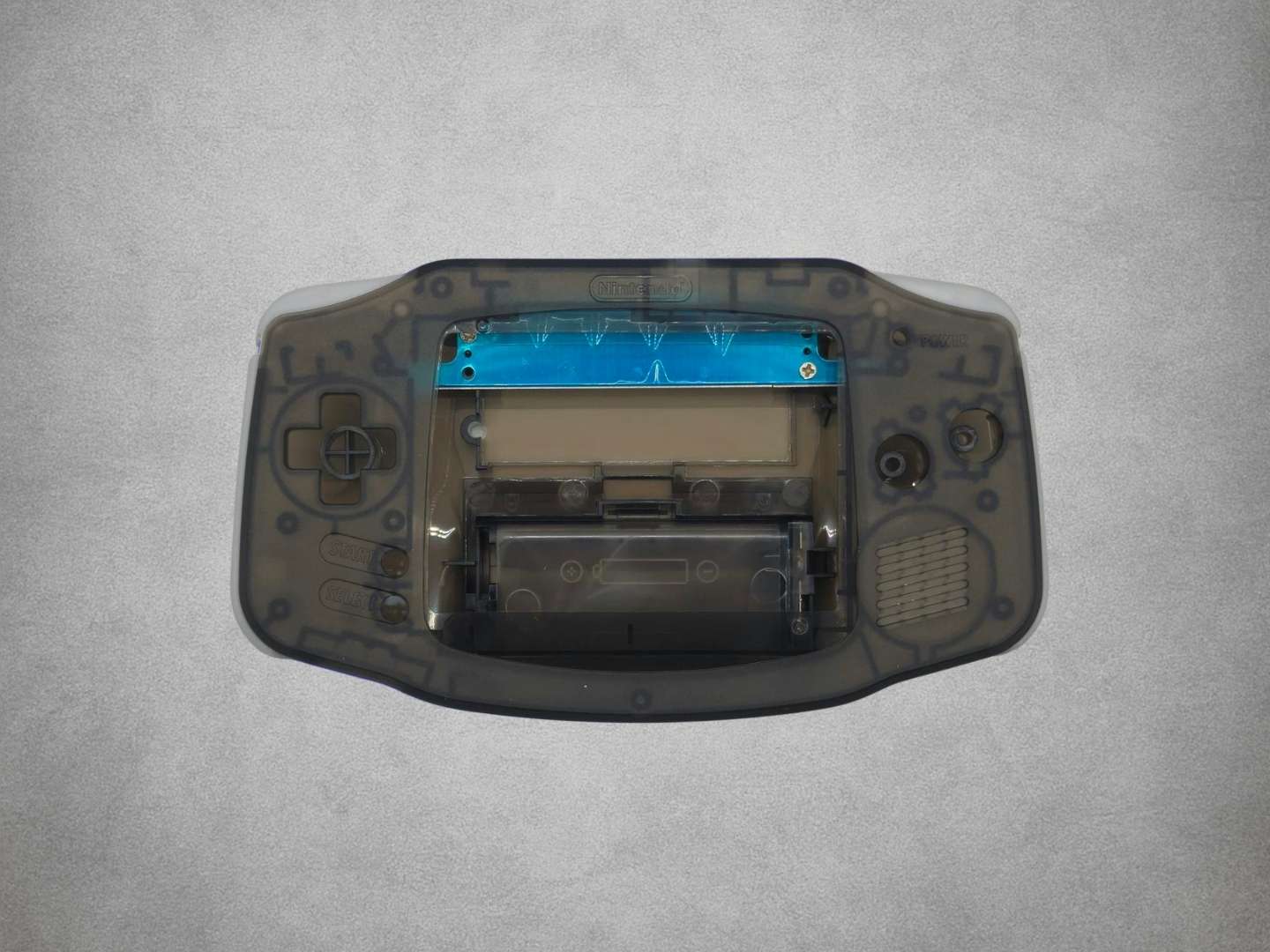 Smokey Black Game Boy Advance shell on grey background