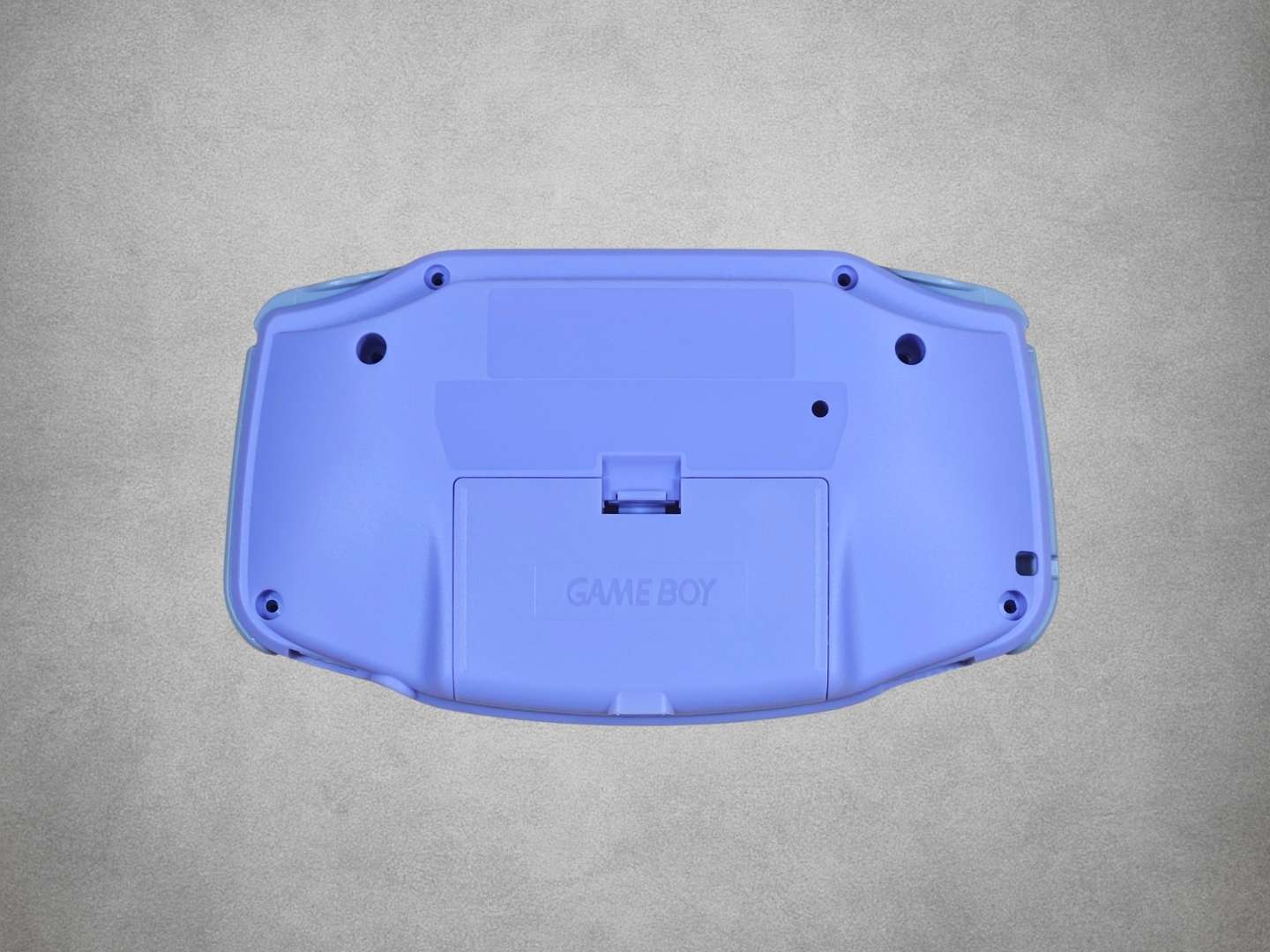 Light Purple Game Boy Advance shell on grey background back