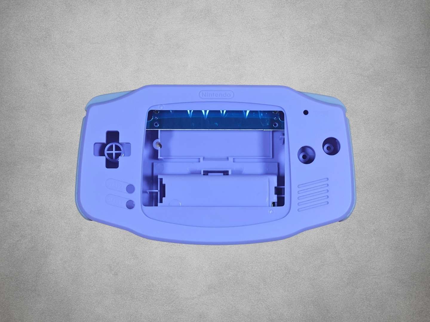 Light Purple Game Boy Advance shell on grey background