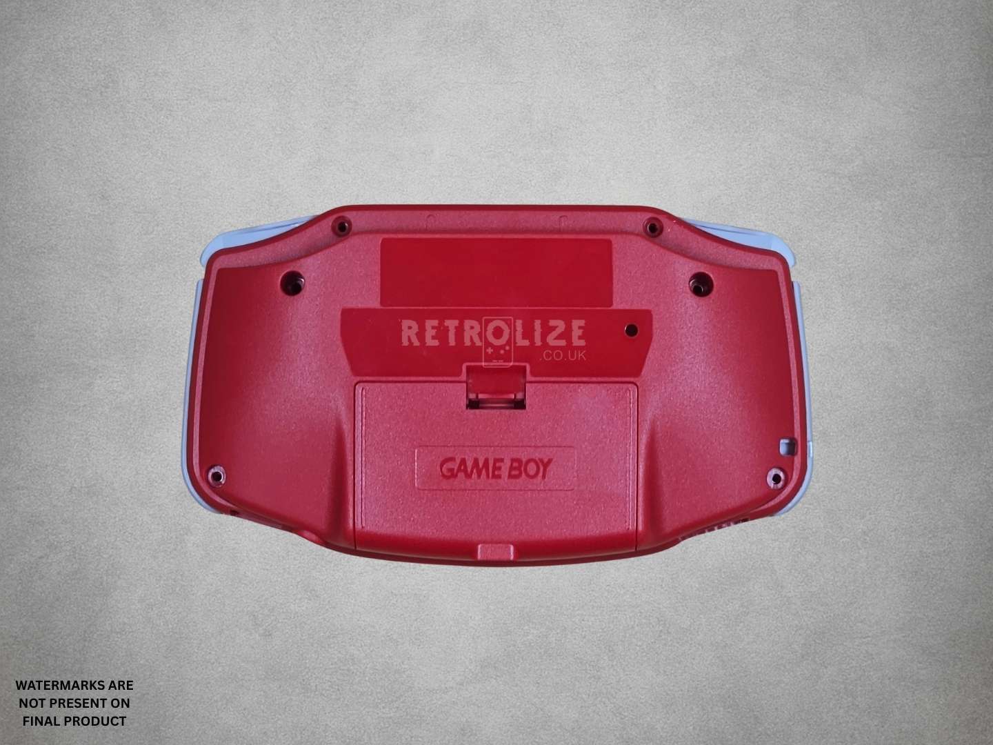 Red Game Boy Advance shell on grey background back