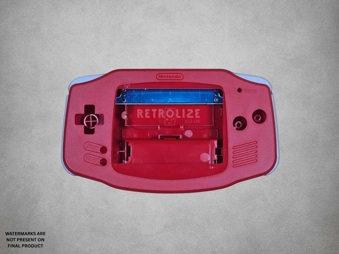 Red Game Boy Advance shell on grey background