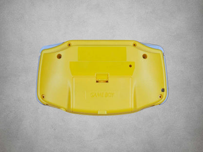 Yellow Game Boy Advance shell on grey background back