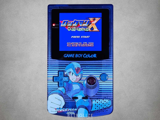 Game Boy Color with Mega Man design on a grey background