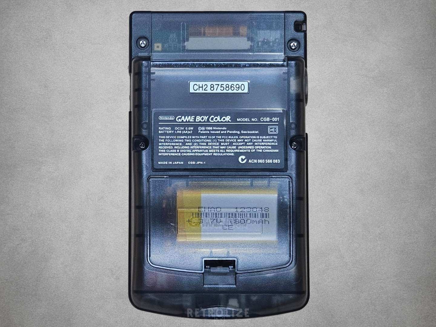 Smokey Black Nintendo Game Boy Color on a gray background Rear View
