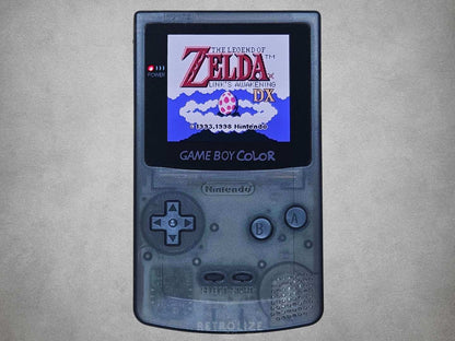 Smokey Black Nintendo Game Boy Color displaying 'The Legend of Zelda' on a gray background