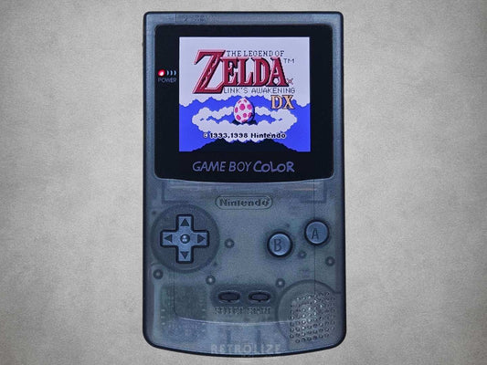 Smokey Black Nintendo Game Boy Color displaying 'The Legend of Zelda' on a gray background