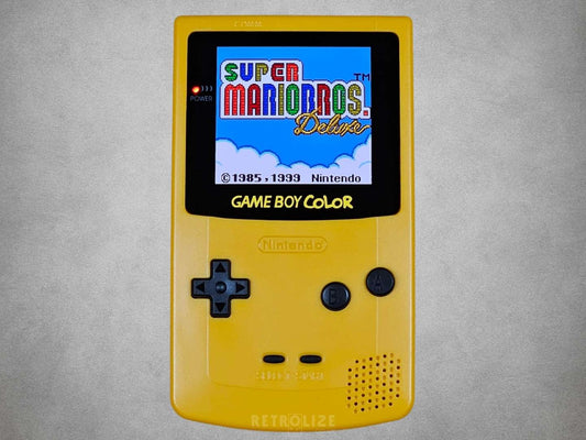 Yellow Dandelion Game Boy Color OLED with Black Buttons with Super Mario Bros Deluxe on the Screen