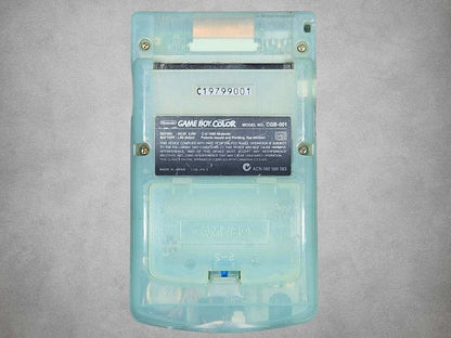 Japan Exclusive Ice Blue Game Boy Color back view on a gray background