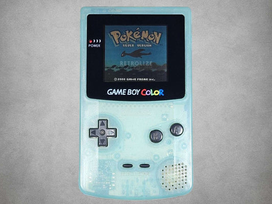 Japan Exclusive Ice Blue Game Boy Color with a screen displaying 'Pokémon' on a gray background