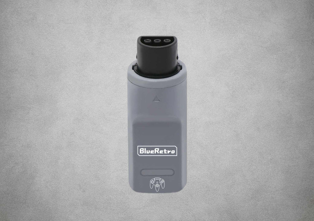 Grey RetroScaler BlueRetro receiver showing its Nintendo 64 controller-port plug and pairing button