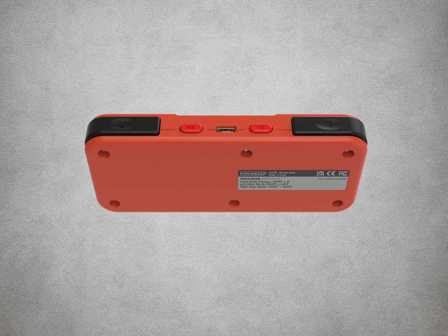 Retro-bit Origin8 NES gaming controller on a gray background